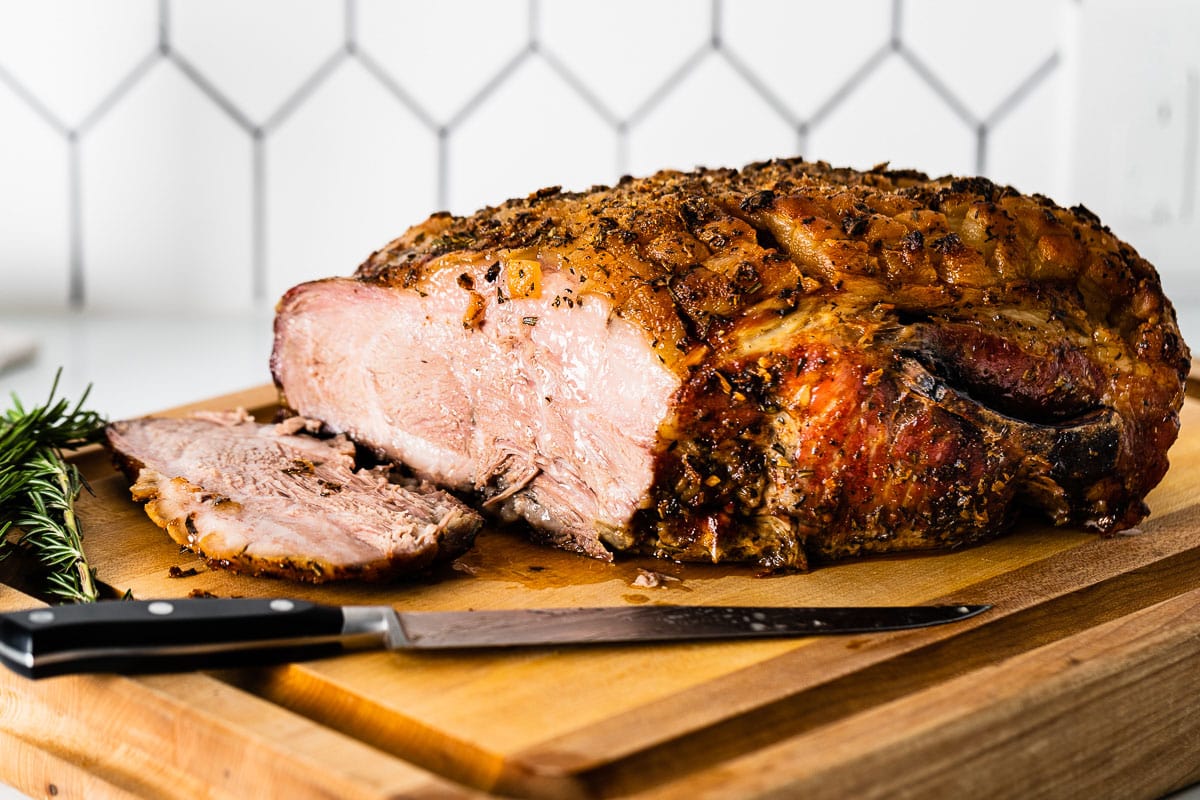 roast-pork-shoulder-sliced-on-cutting-board-vertical.jpg